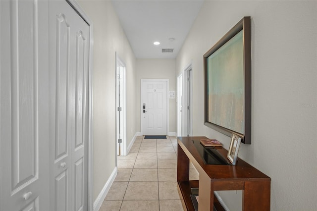 corridor with light tile patterned floors