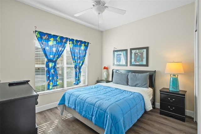 bedroom featuring ceiling fan and dark hardwood / wood-style flooring