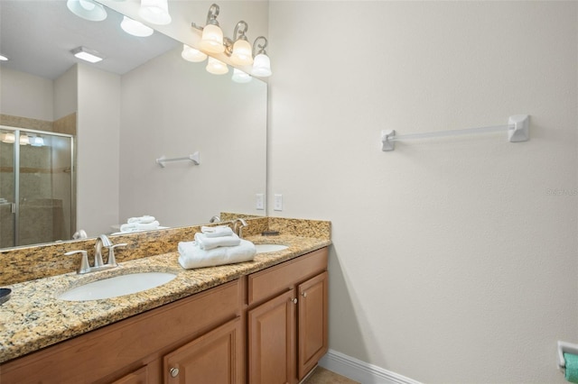 bathroom with vanity and a shower with shower door