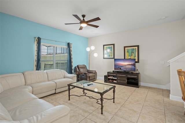 tiled living room featuring ceiling fan