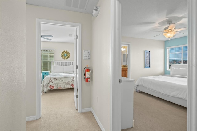 carpeted bedroom featuring ceiling fan