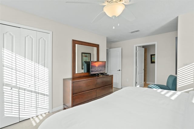 bedroom featuring ceiling fan and a closet