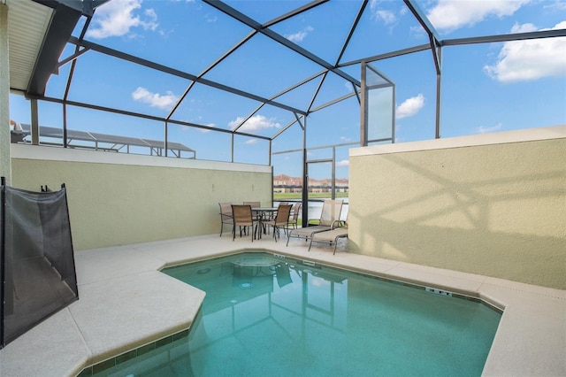 view of pool featuring a patio area and a lanai