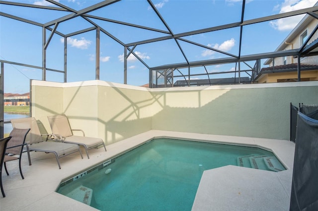 view of pool featuring a lanai and a patio area