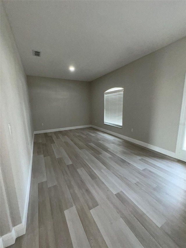 spare room featuring light wood-type flooring