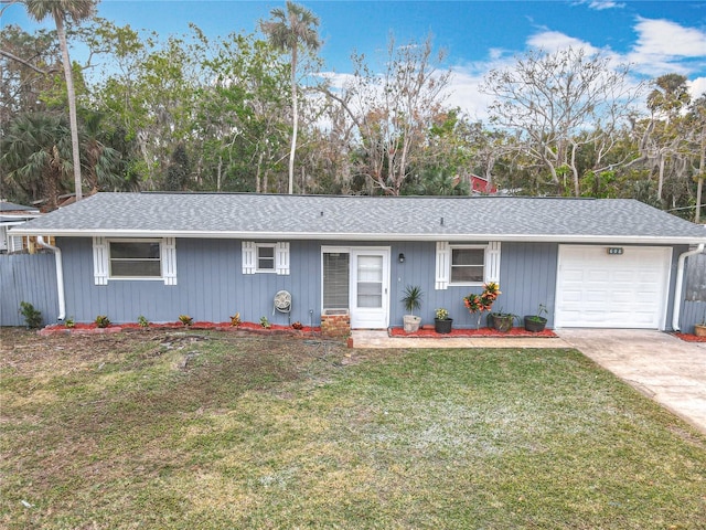 ranch-style home with a front yard and a garage