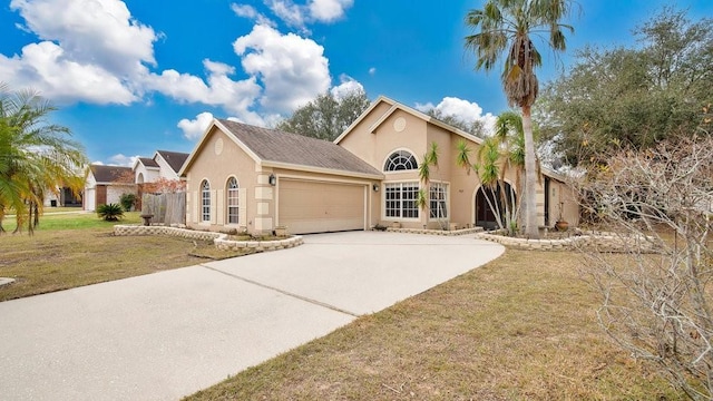 view of front of home featuring a front lawn and a garage