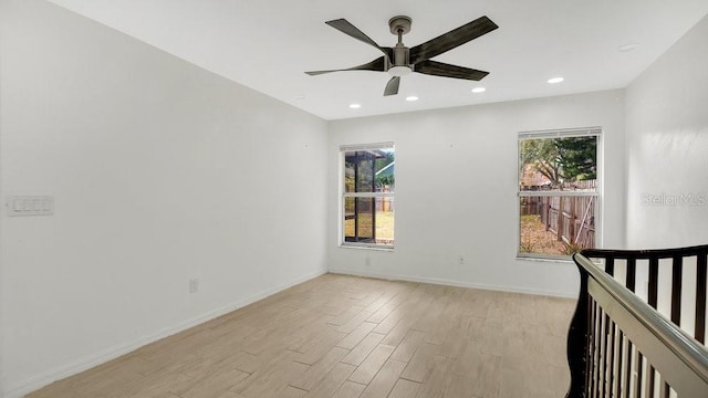 unfurnished bedroom with ceiling fan and light hardwood / wood-style floors