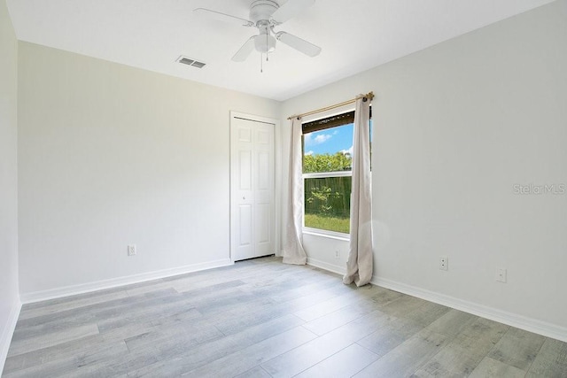 905 Hatteras Ave, Minneola, FL 34715 - spare room featuring light wood-style flooring, ceiling fan, and baseboards