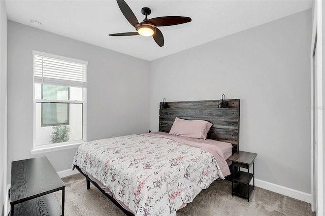 bedroom with ceiling fan and carpet floors