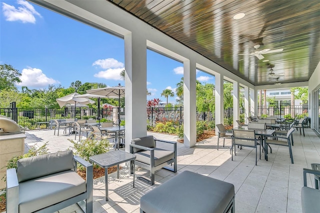 view of patio with ceiling fan and an outdoor hangout area