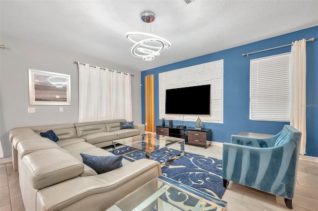 living room with a textured ceiling and a notable chandelier