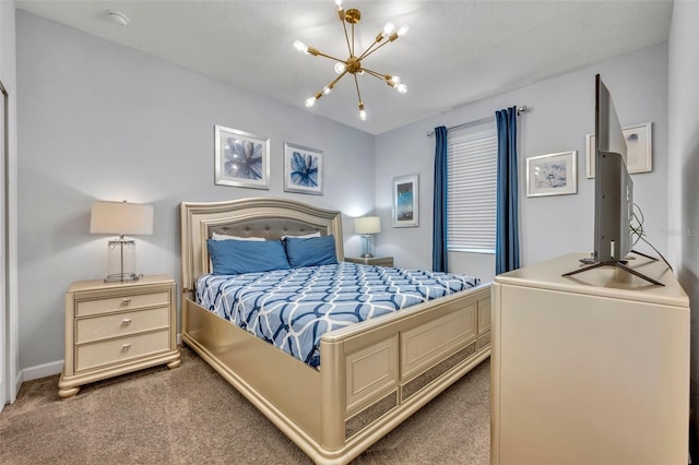 carpeted bedroom with a chandelier