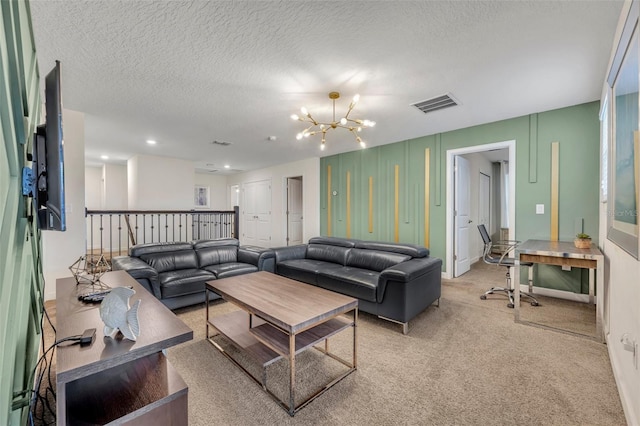 living room featuring a textured ceiling, a chandelier, and light carpet