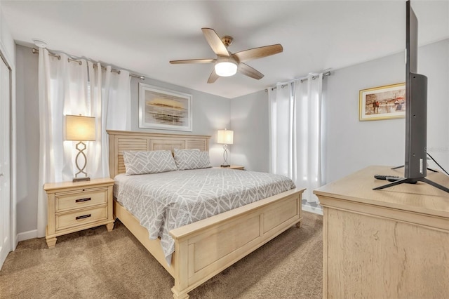 carpeted bedroom featuring ceiling fan