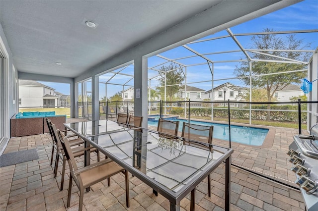 sunroom / solarium with a swimming pool