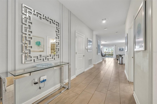 hallway featuring light tile patterned floors