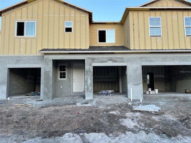 view of front of house with board and batten siding and an attached garage