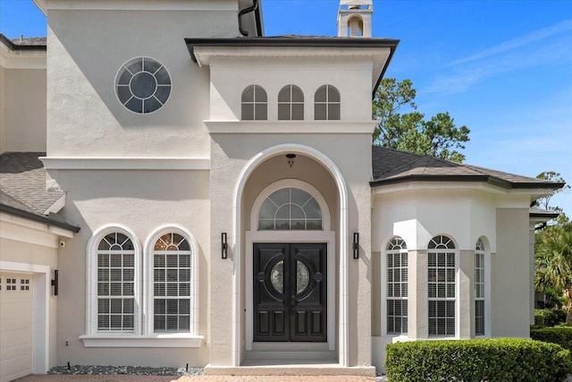 entrance to property featuring a garage