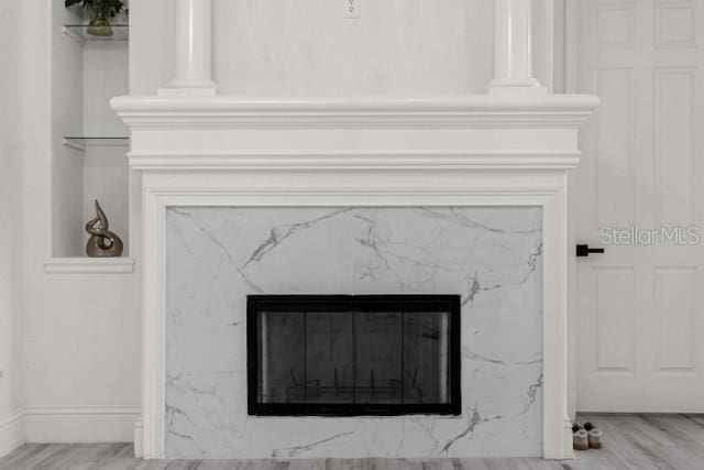 details featuring a high end fireplace