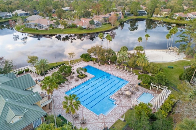 birds eye view of property with a water view