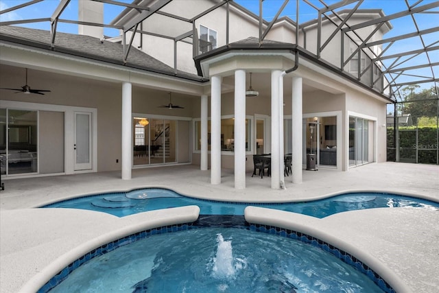 view of swimming pool with a patio, ceiling fan, and an in ground hot tub