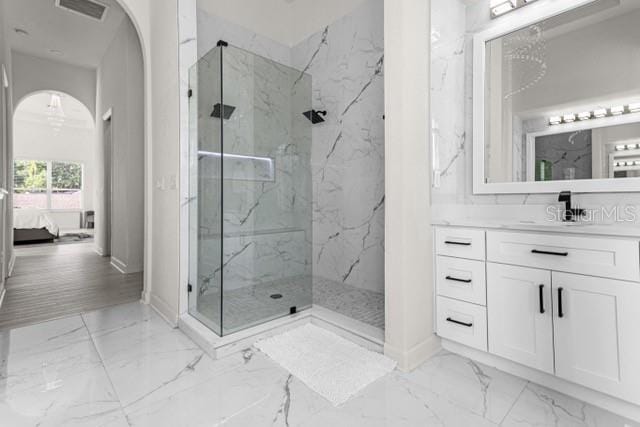 bathroom featuring vanity and a tile shower