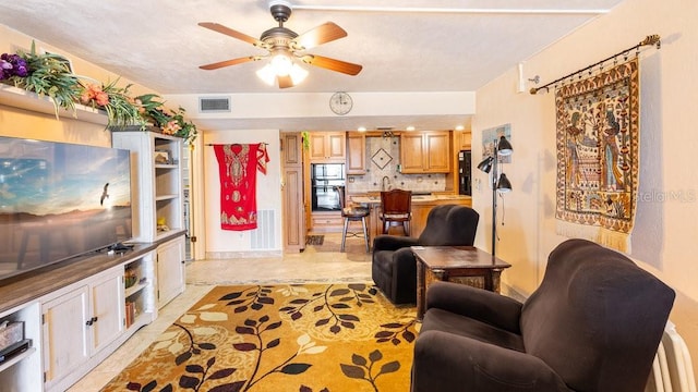 living room with ceiling fan