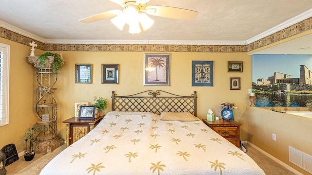 bedroom with carpet flooring, ceiling fan, and ornamental molding