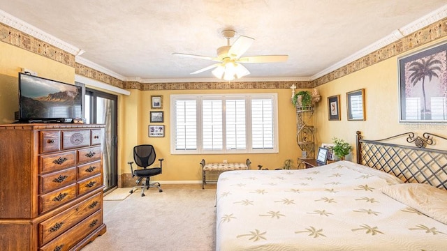 carpeted bedroom with ceiling fan, crown molding, and a textured ceiling