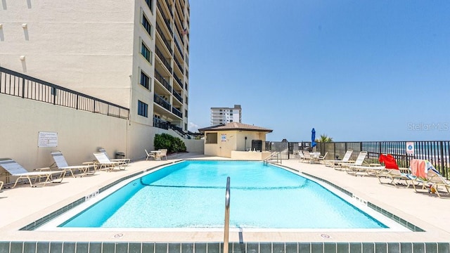 view of pool featuring a patio