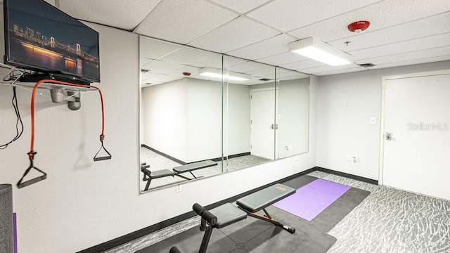 exercise area featuring a paneled ceiling