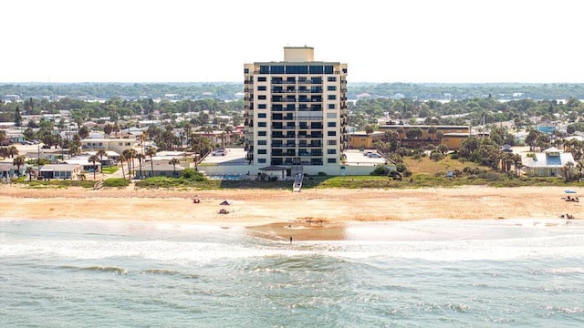 bird's eye view featuring a water view and a view of the beach