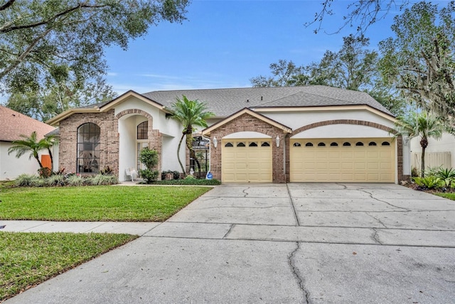 ranch-style home with a front lawn and a garage