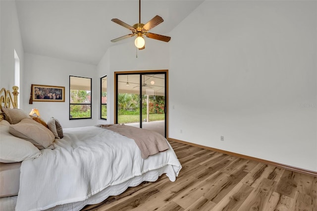 bedroom featuring ceiling fan, vaulted ceiling, access to outside, and light wood-type flooring