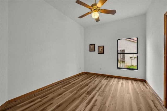 empty room featuring ceiling fan and light hardwood / wood-style flooring