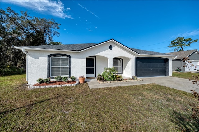 ranch-style house featuring a garage and a front yard