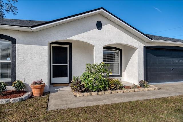 doorway to property featuring a garage