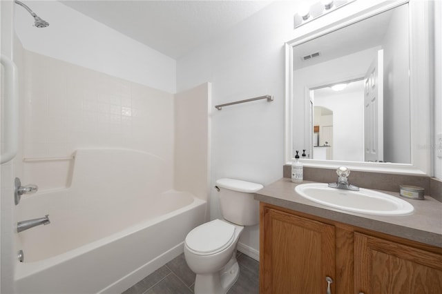 full bathroom with shower / bathing tub combination, vanity, tile patterned flooring, and toilet