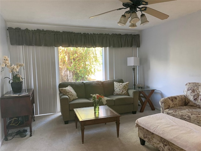 living room with ceiling fan and light carpet