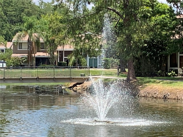 surrounding community with a water view