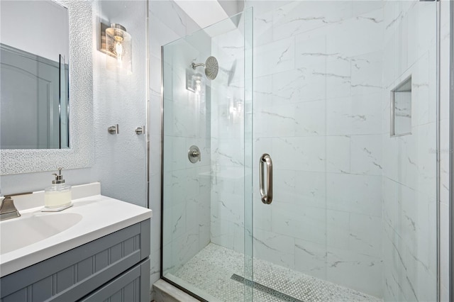 bathroom with vanity and an enclosed shower