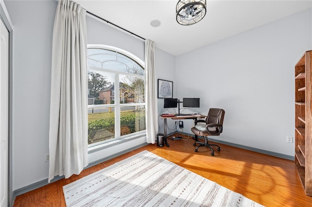 office area with hardwood / wood-style floors