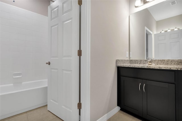 bathroom featuring vanity, tile patterned floors, and tub / shower combination