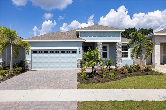 view of front facade with a front lawn and a garage