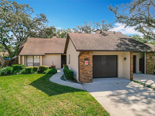 view of front facade with a garage and a front lawn