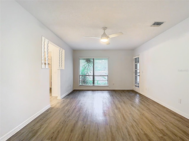 spare room featuring hardwood / wood-style flooring and ceiling fan