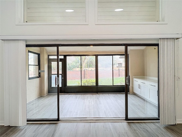 doorway to outside with light hardwood / wood-style floors