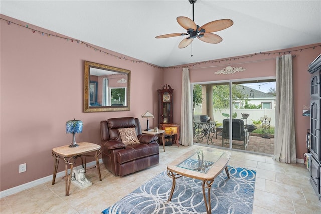 living room with ceiling fan and vaulted ceiling