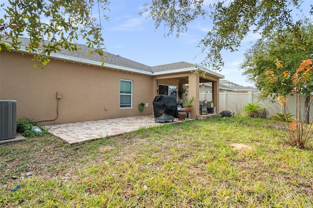 view of yard with a patio area and central AC